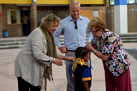 MP Michael Cardo and Mayor Nicolette Botha-Guthrie, along with Ward 4 Councillor Lianda Beyers-CronjÃ© assist a grade-one learner with her backpack at the specially marked ceremony at Mount Pleasant Primary,   where  three  classes  of  grade-one  learners  received  a   stationery-filled backpack courtesy of the Ward 4 Backpack Project.